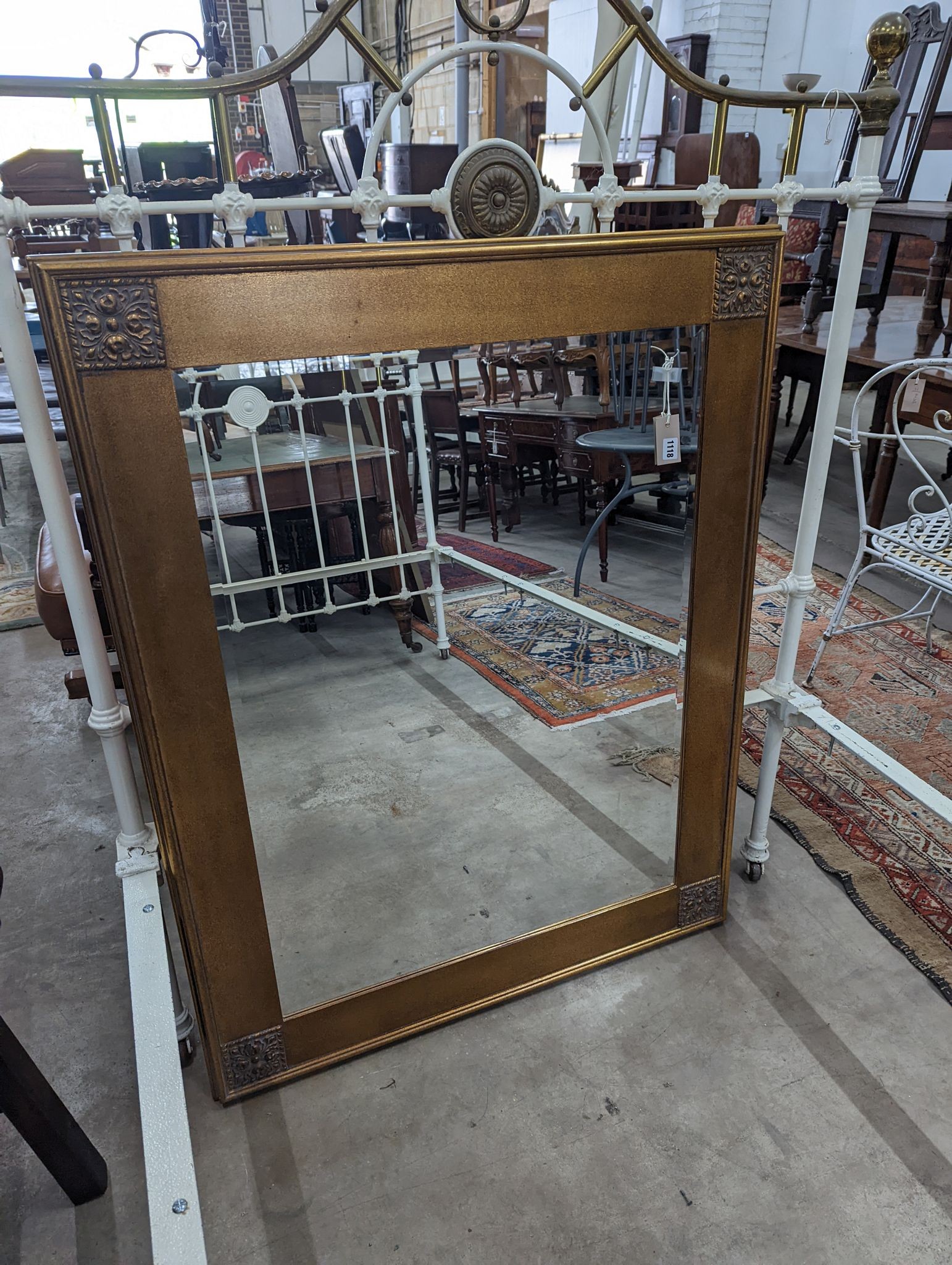 A modern gilt framed painted rectangular overmantel mirror, width 99cm, height 125cm